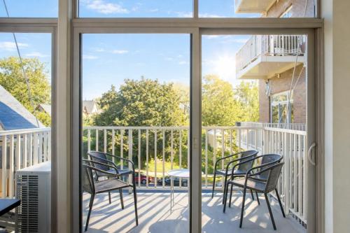 a view from a balcony with chairs and a table at East Side Luxury 1BR Apt - Near Brady and Fiserv with Balcony - Sleeps 5 in Milwaukee