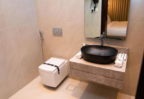 a bathroom with a sink and a toilet at Princess House in Jeddah