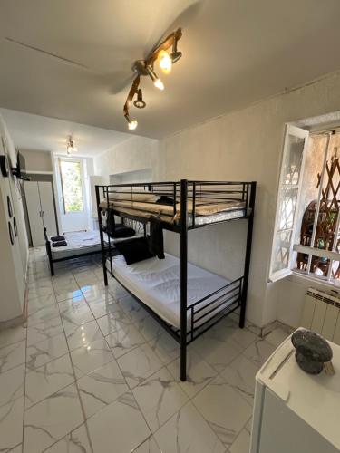 En eller flere senge i et værelse på Casa Bianca
