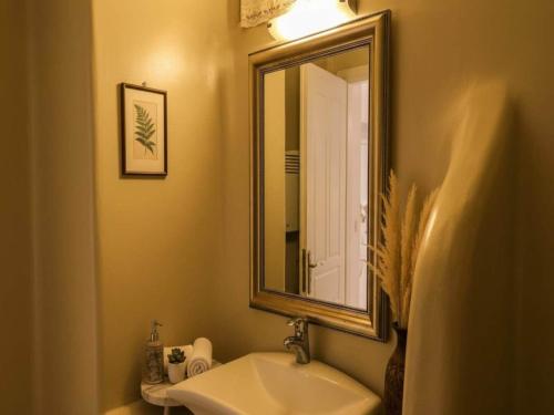 a bathroom with a sink and a mirror at Ano Mera Villa with Private Pool in Ano Mera