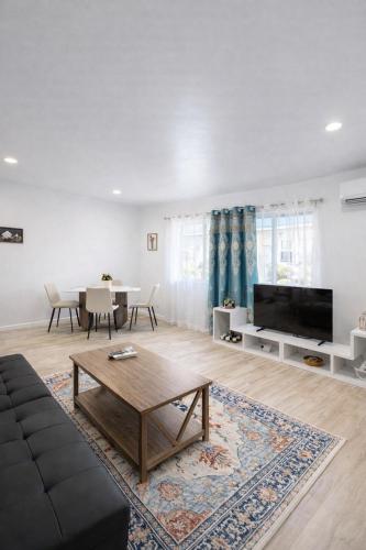 a living room with a couch and a table at Stay in the Heart of Hillcrest! in San Diego