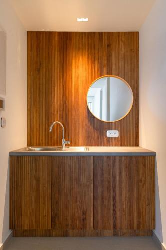 a bathroom with a sink and a mirror at Kokkari Villa in Kokkari