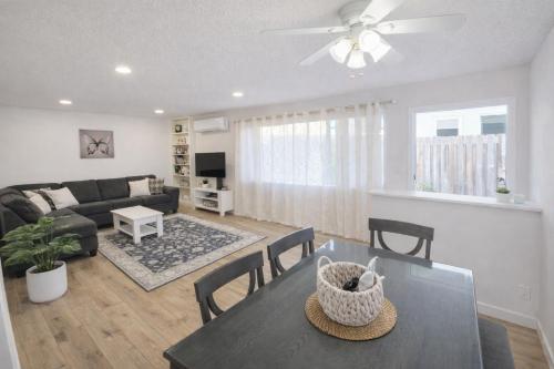 a living room with a table and a couch at Stay in the Heart of Hillcrest! in San Diego