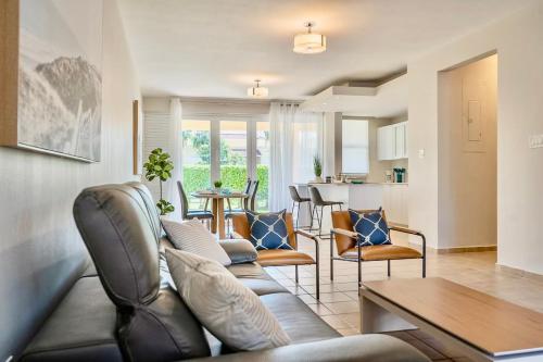 a living room with a couch and a table at Solimar Villa Family Vacation Spot in Playa de Guayanes