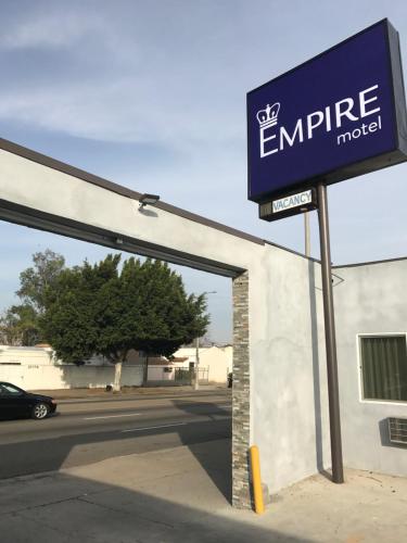 a sign for an entrance to an emprise motel at Empire Inn in Los Angeles