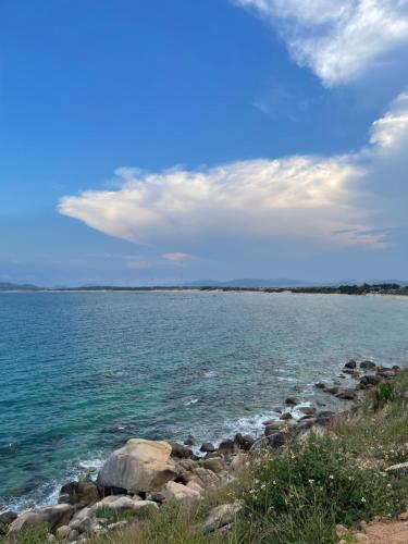 a group of rocks on the shore of a body of water at Ánh Dương Local Mini Tour in An Lợi (4)