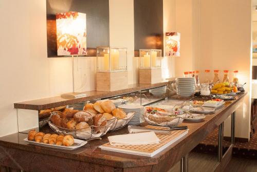 a buffet line with many different types of food at Romantik Hotel Schubert in Lauterbach