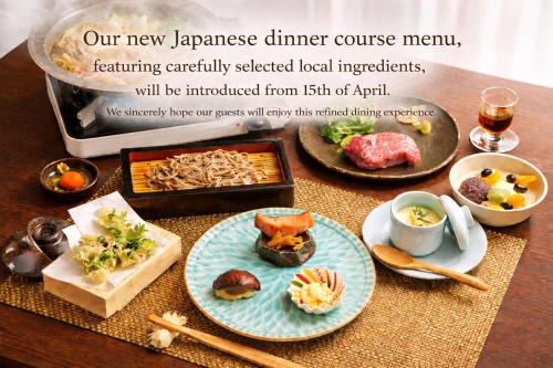 a table topped with plates of food on a table at Hatago Nagomi in Nikko