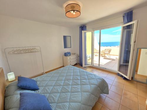 a bedroom with a bed with a view of the ocean at ALBA MARINA Experience Peñiscola in Peniscola