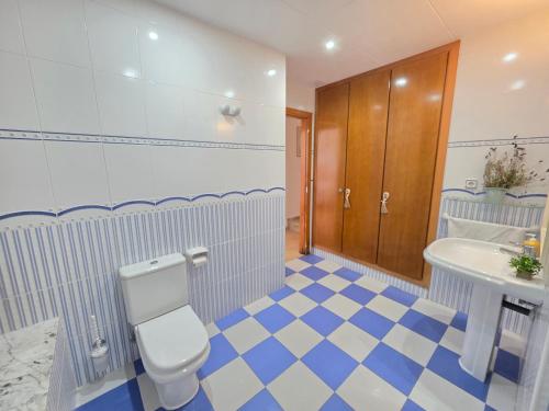 a bathroom with a toilet and a sink at ALBA MARINA Experience Peñiscola in Peniscola