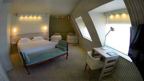 Una cama o camas en una habitación de Hotel Las Terrazas Business