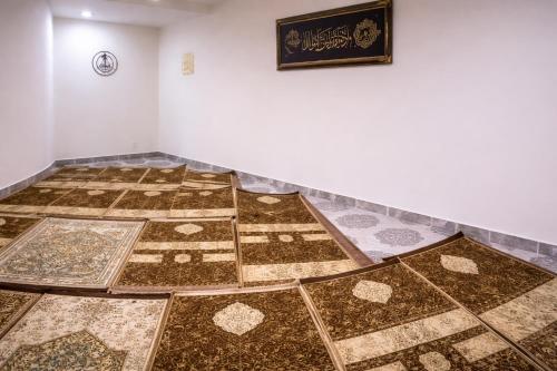 a room with a floor with mosaics on it at Bridge Residency in Muzaffarabad
