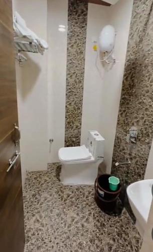 a bathroom with a toilet and a sink at Zoz jhodpur in Jodhpur