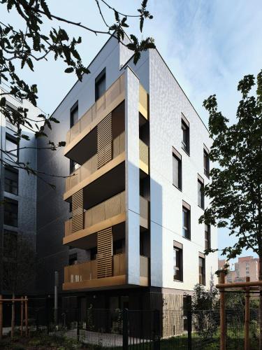 a building with balconies on the side of it at Penthouse 166 m2- Terrasse & Parking - Paris Sud - Orly - Parc Expo in Bagneux