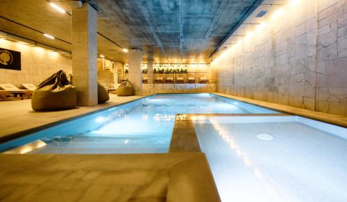 a large swimming pool in a large room with at LOFT Hotel & SPA in Bukovel