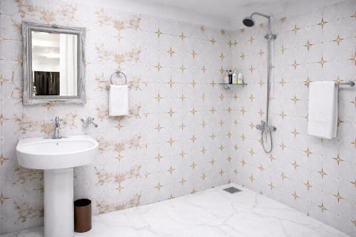 a bathroom with a sink and a mirror at Bridge Residency River View Hotel Near Bridge,201 in Muzaffarabad
