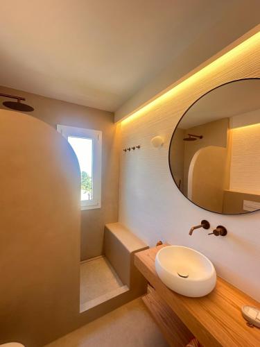 a bathroom with a sink and a mirror at La Terraza de la Sabina in Es Mercadal