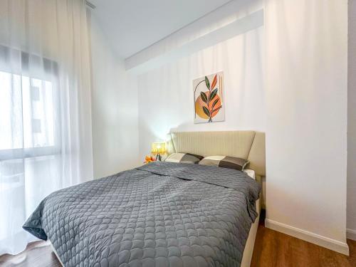a bedroom with a large bed in a room at 214 The Coastal Nest in Durrës