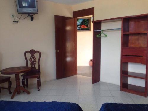Postel nebo postele na pokoji v ubytování Hotel Lienzo Charro 1