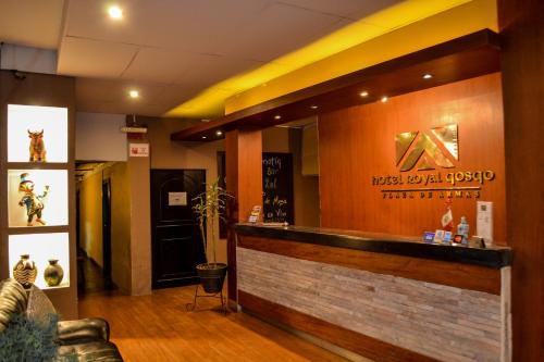 a lobby of a restaurant with a sign on the wall at Hotel Royal Qosqo in Cusco