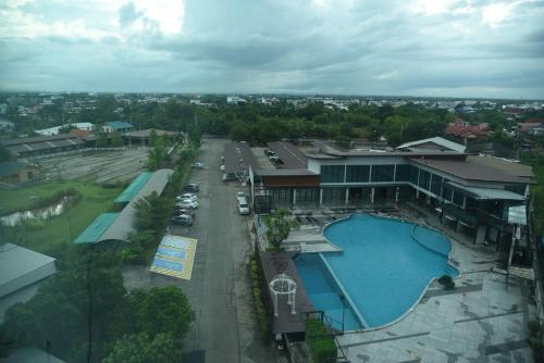 an overhead view of a resort with a swimming pool at Prajaktra Design Hotel in Udon Thani
