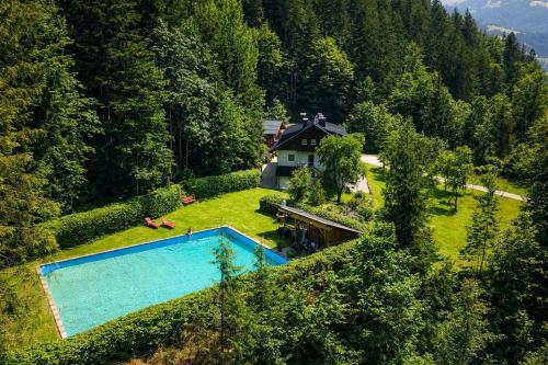 an aerial view of a house with a swimming pool at Beim Talschuster in Scheffau am Wilden Kaiser