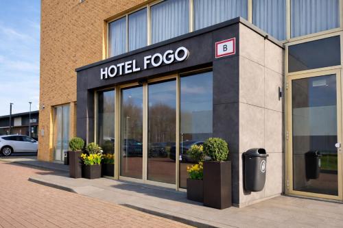 a hotel foco sign on the side of a building at Hotel Fogo Amsterdam in Amsterdam
