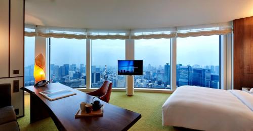 a hotel room with a bed and a large window at Andaz Tokyo - A Concept by Hyatt in Tokyo