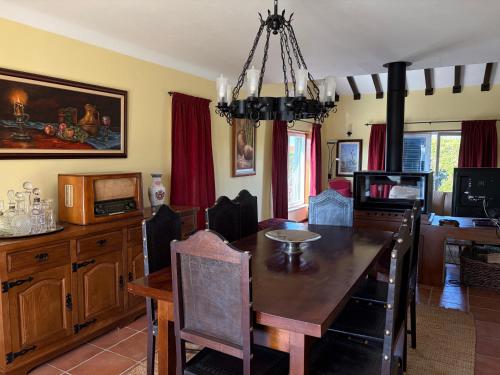 a dining room with a dining table and a dining room at Quinta de Toubres in Murça