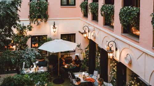 an outdoor restaurant with people sitting at tables at MJ's in Malmö