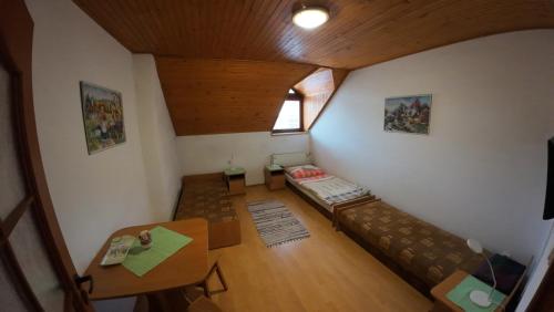 an overhead view of a living room with a couch and a table at Penzion Kokava in Kokava na Rimavica