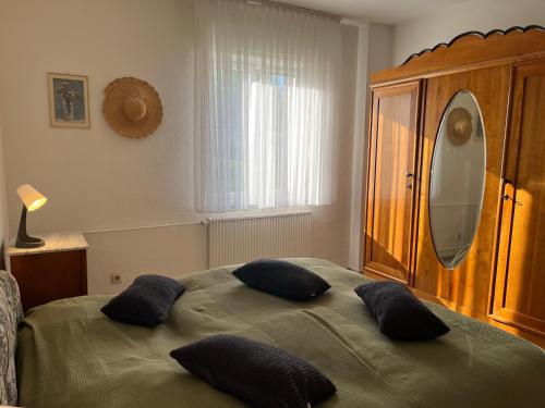 a bedroom with a bed with two pillows on it at Auf dem Karlsberg in Weilburg
