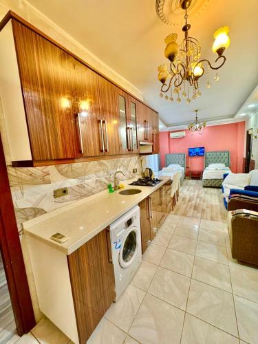 a kitchen with a washer and dryer in a room at Sultanahmet Lİfe Apart in Istanbul