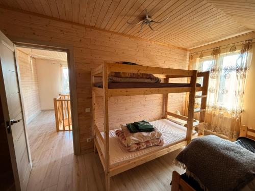 a room with two bunk beds in a cabin at Igor House in Jūrmala