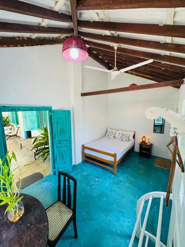 a living room with a bed and a table and chairs at Villa Ceylora in Busse