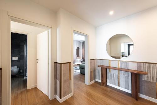 a bathroom with a table and a mirror at Boutique Suites in Lugano