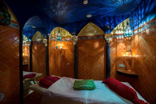 a bedroom with a bed with a blue ceiling at Marcienas Muiza & SPA in Mārciena