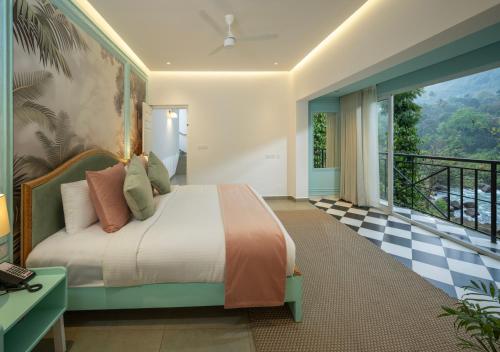 a bedroom with a bed and a checkerboard floor at Blanket Riverside Resort and Spa in Munnar