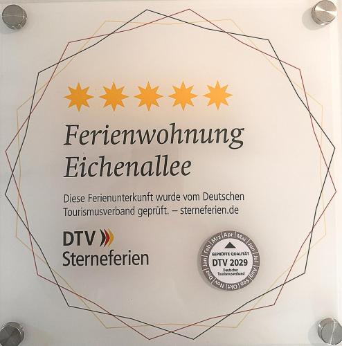 a sign for the fern wolfgang refrigerator with stars at Traumhafte Ferienwohnung am Park, großer Balkon, voll ausgestattete Küche, Schreibtisch, WiFi, Smart TV, Carport, Wallbox, Fahrräder in Scheeßel