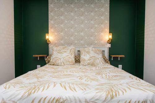 a bedroom with a white bed with green walls at Le Clos de Narco in Vernosc-lès-Annonay