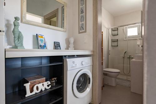a laundry room with a washer and dryer at Villa Theros in Ierapetra