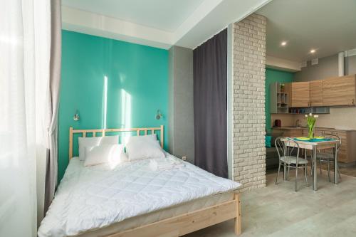 
Кровать или кровати в номере Апартаменты на Станиславского 11
