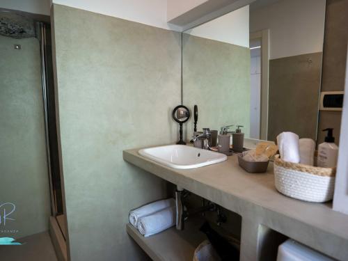 a bathroom with a sink and a mirror at Ochin de Ma' a Boccadasse - Genovainrelax in Genoa