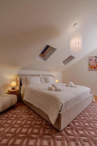 a bedroom with a large bed and a couch at Vanilla Suite · Kilchberg in Kilchberg