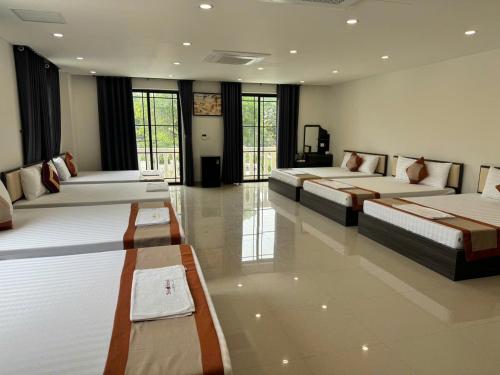 a large room with two beds in it at Luxury Hotel in Tây Ninh