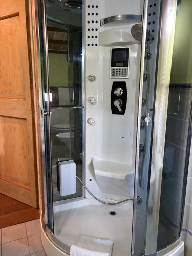 a shower with a glass door in a bathroom at Terra e Mare in Santa Maria Pietrafitta