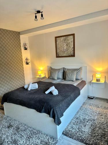a bedroom with a bed with two towels on it at NextSpace Nr 2 in Sfântu-Gheorghe