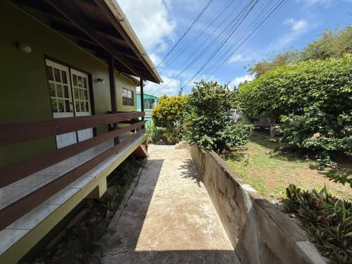 a house with a pathway next to a building at The Corinth House in Corinthe