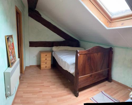 a bedroom with a bed and a skylight at La grange un refuge in Mijanès