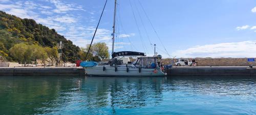 a sail boat is docked in the water at ARGO III Sailing Yacht in Skiathos